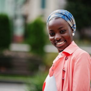 Young modern fashionable, attractive, tall and slim african muslim woman in hijab or turban head scarf posed.